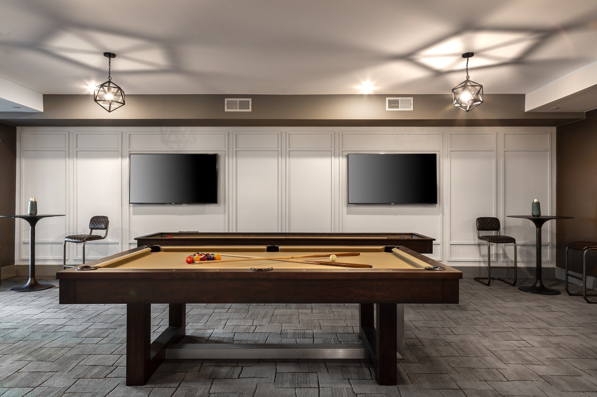 Billiards table in game room for residents at Providence Row Apartments